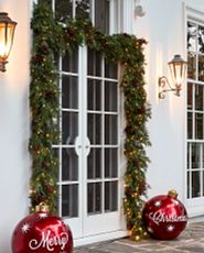 Door decorated with a traditional Christmas garland