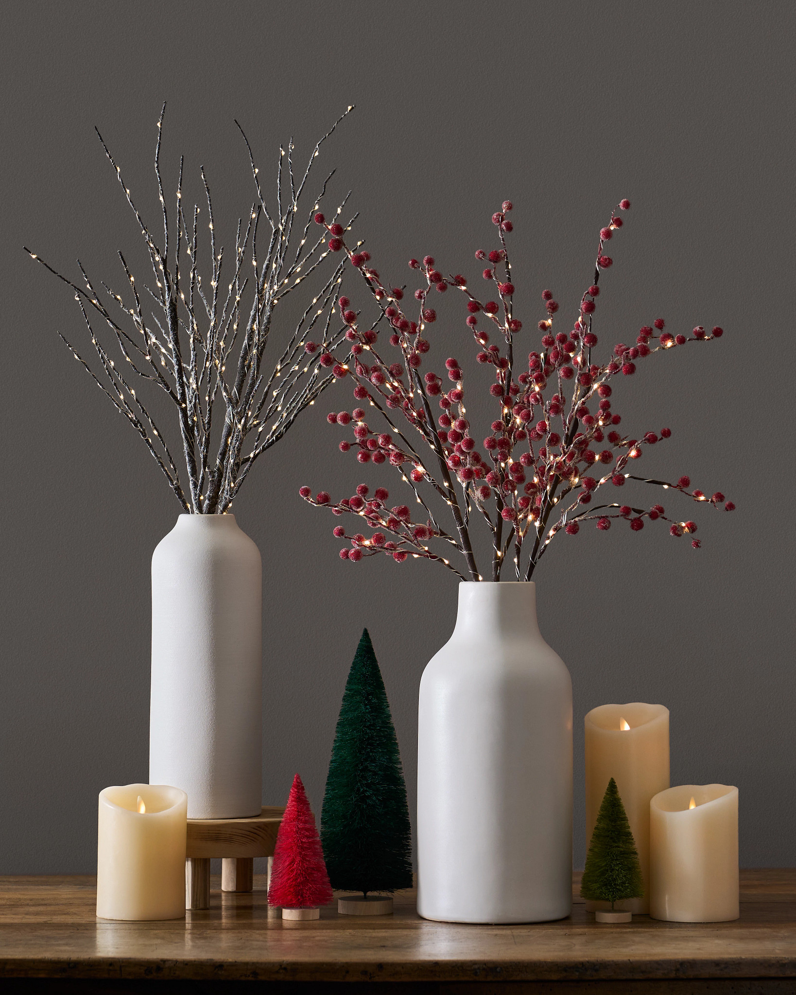Artificial berry branches and twigs in vase