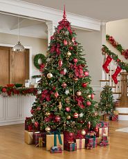 Artificial Christmas tree with red and gold ornaments