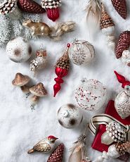 Alpine Grove Christmas ornaments against a snow background