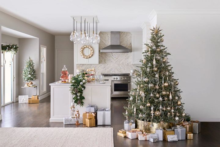 Artificial Christmas tree in the kitchen and dining area decorated with silver and gold ornaments