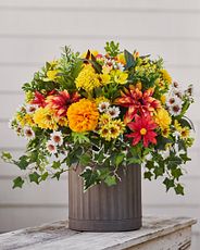 Artificial potted flowers with dahlias, daisies, carnations, ivy, and leaves