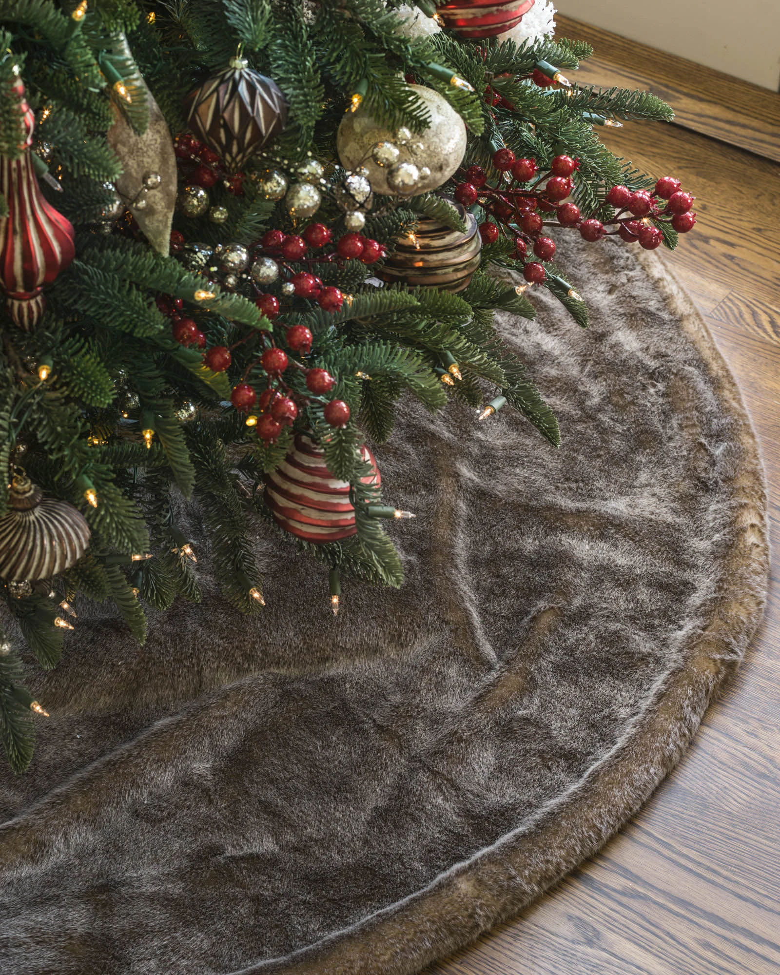 Faux fir tree skirts in gray, brown, and ivory colors