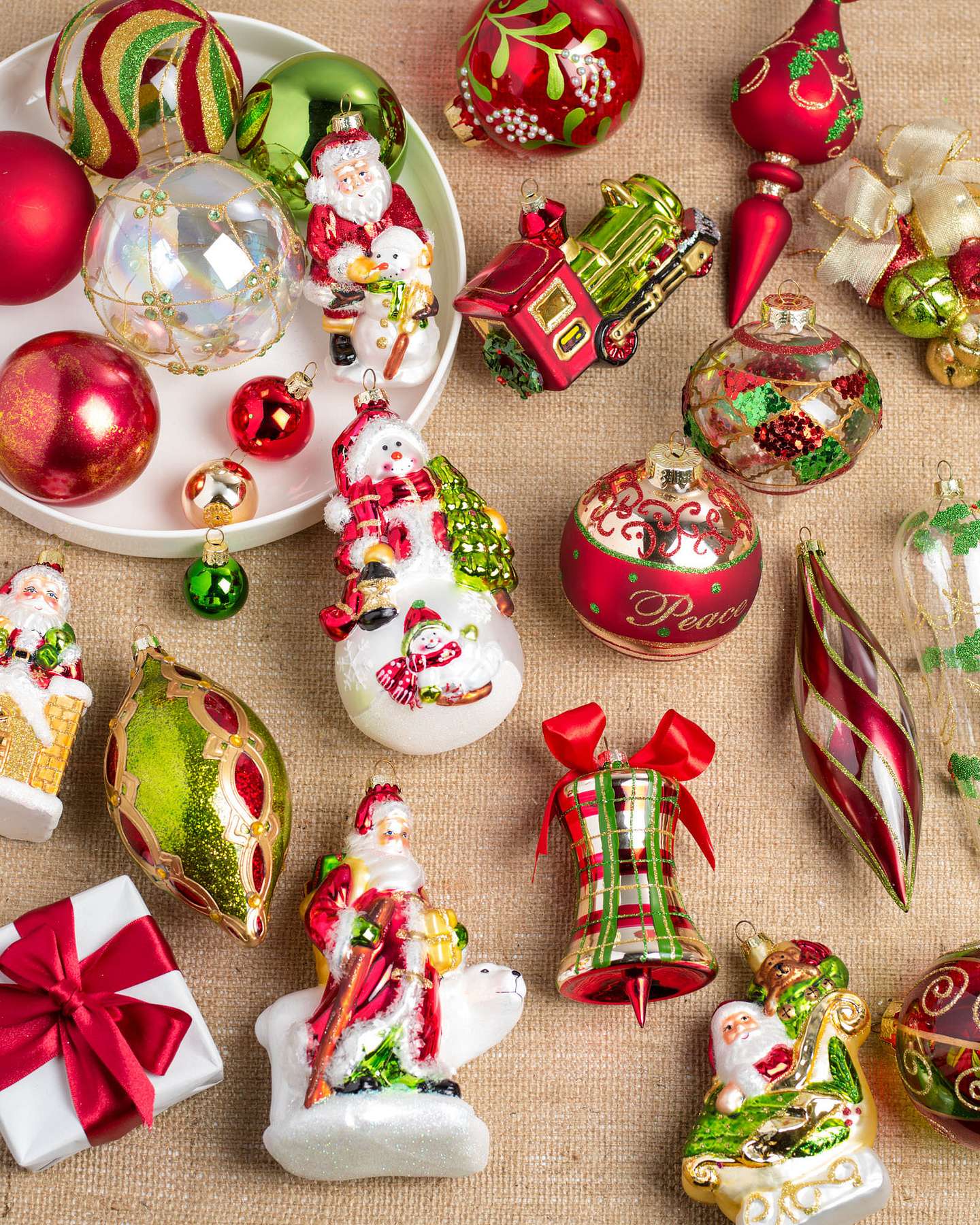 Balsam Hill Mistletoe and Holly Glass Christmas Ornaments Displayed in Seasonal Arrangement