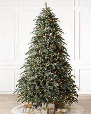 Noble fir artificial Christmas tree pre-lit with clear lights