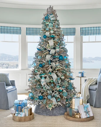 Christmas tree with aqua blue, silver, and white ornaments