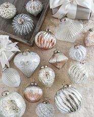 Assorted mercury glass ornaments in blush and silver