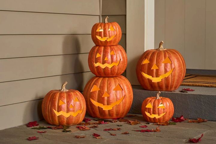 Artificial carved Jack-o’-Lanterns displayed on the porch