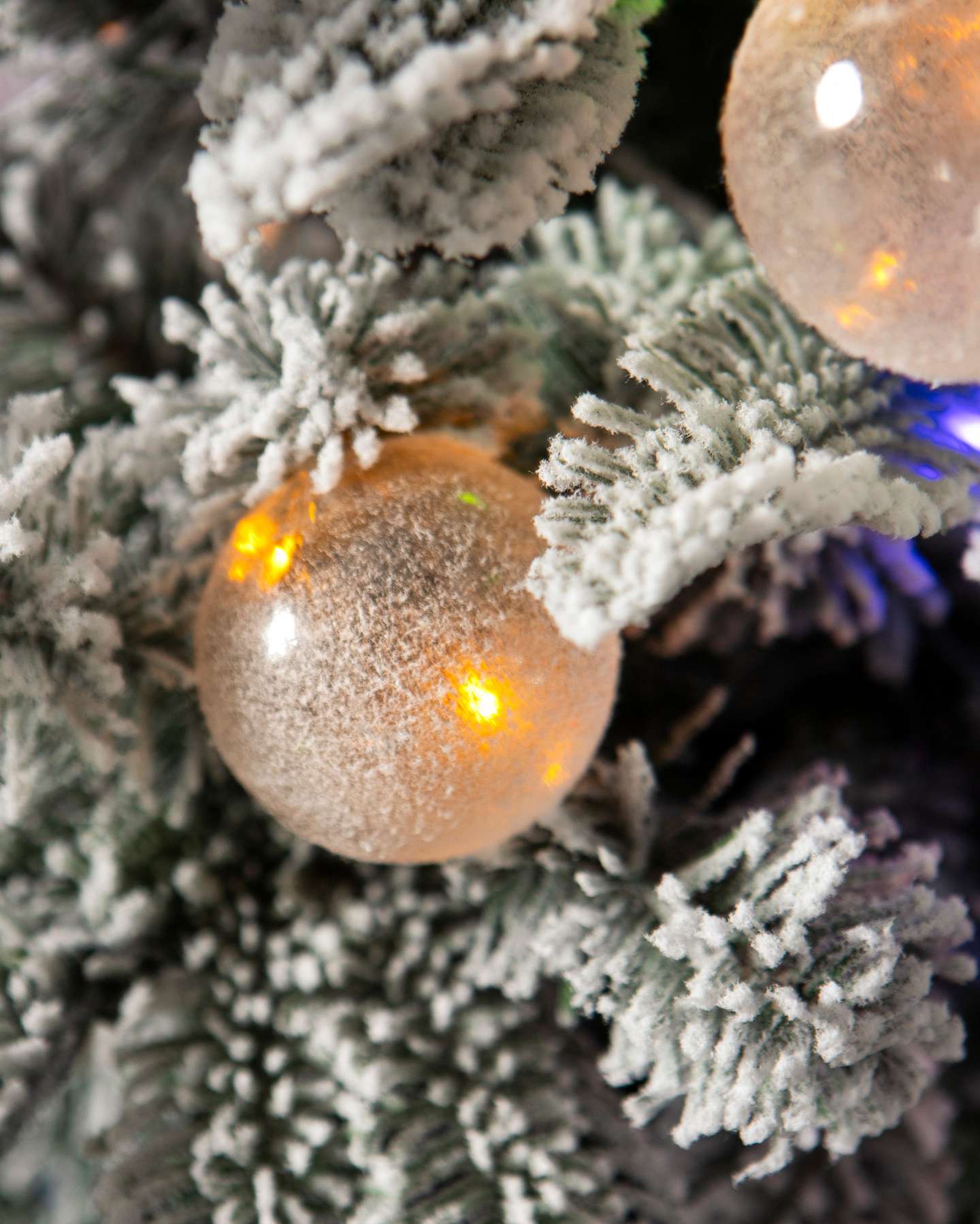 Balsam Hill 3-Foot Snow Flurry Potted Artificial Christmas Tree with LED Multicolor Lights Closeup