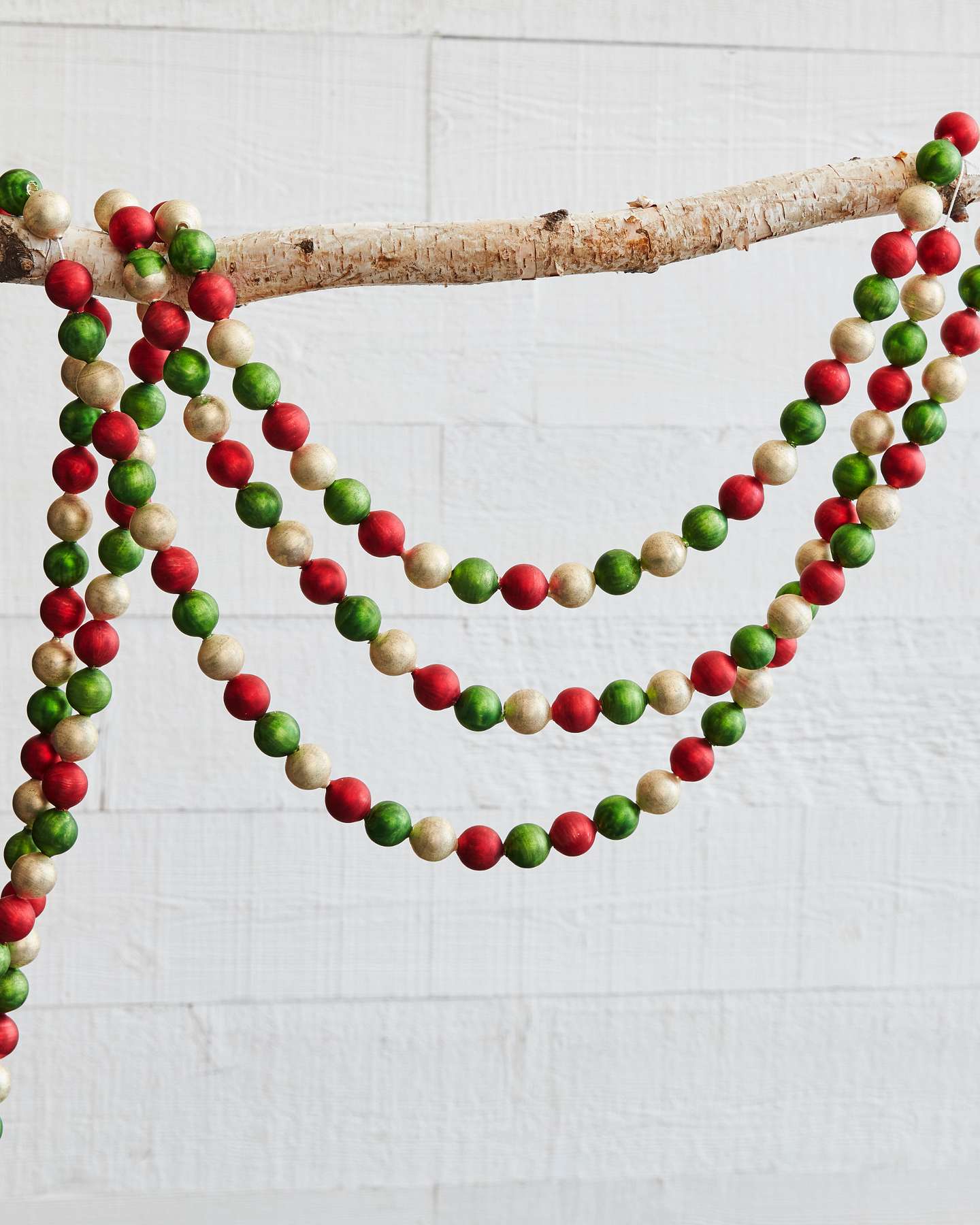Balsam Hill Jeweled Artificial Christmas Tree Garland Lifestyle Displayed on Branch