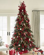 Decorated Christmas tree with red berries and ornaments
