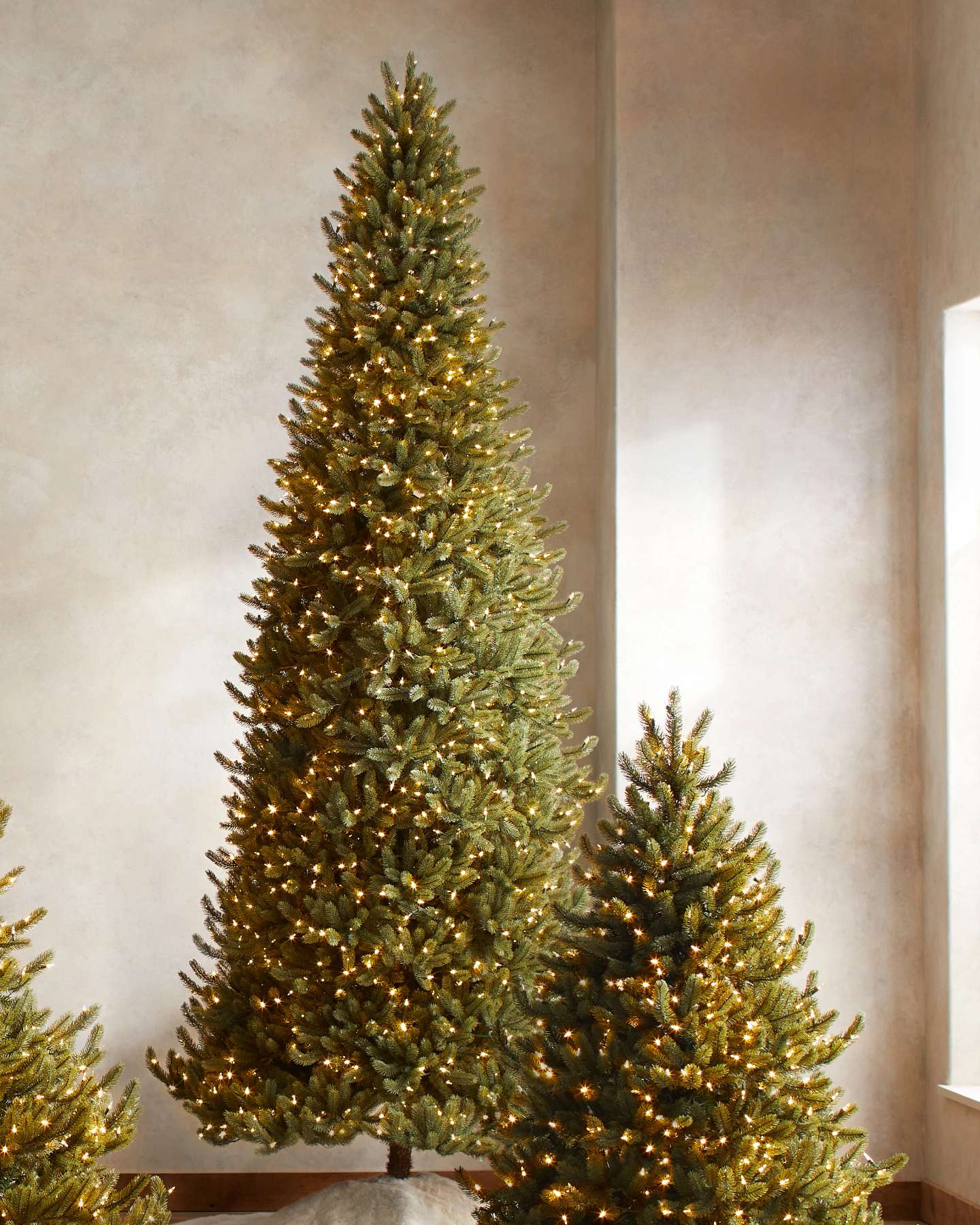 Balsam Hill Vermont White Spruce Narrow Artificial Christmas Tree in a Cozy Home Setting