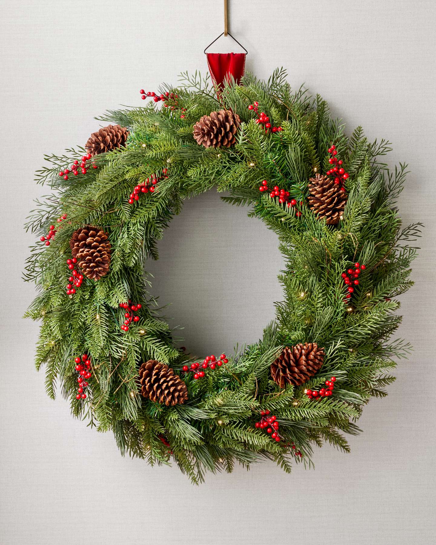 Balsam Hill 32-Inch Double-Sided Red Berry Pinecone Wreath Lit Closeup