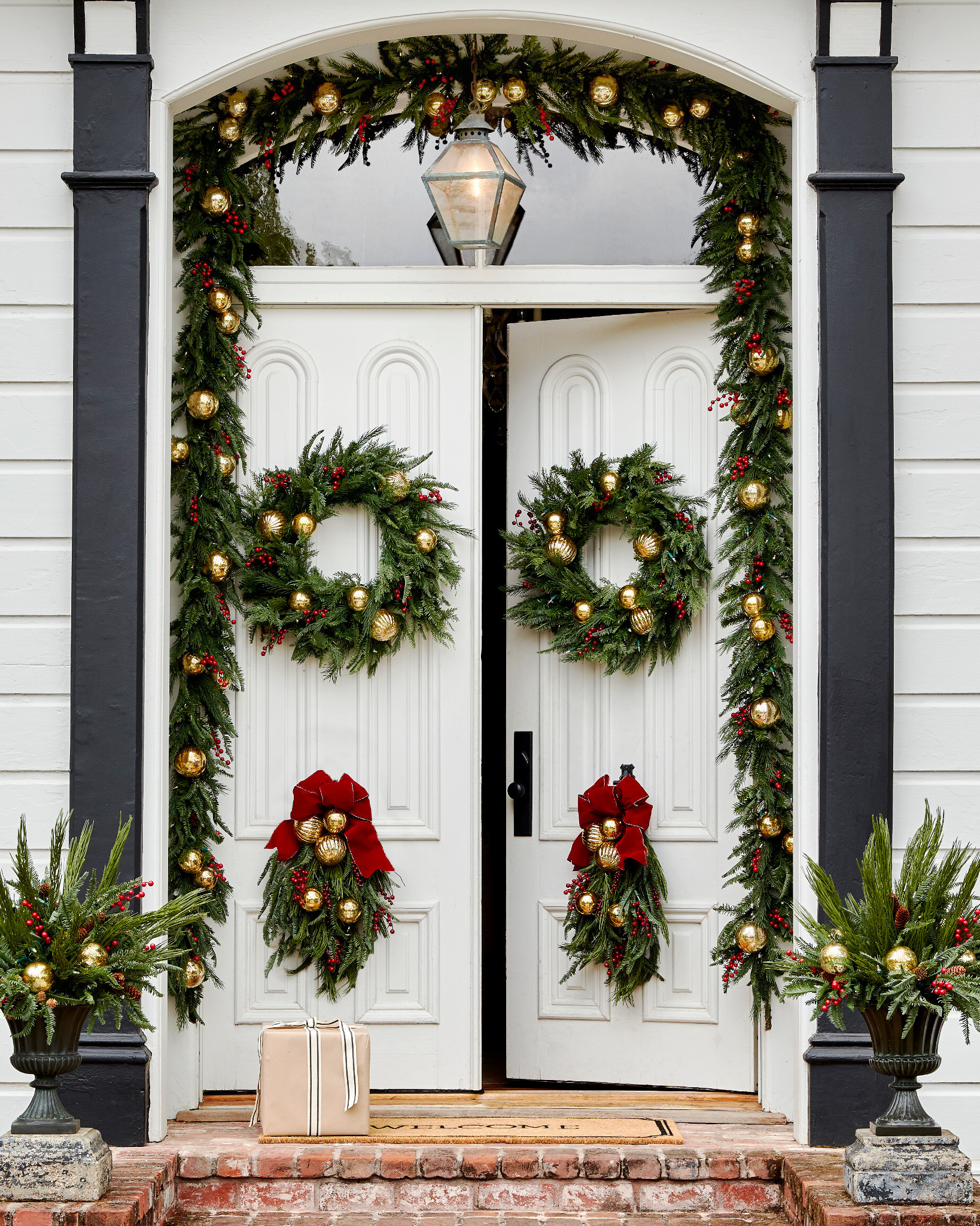 Double doors with artificial Christmas greenery