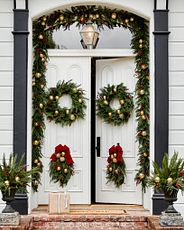 Double doors with artificial Christmas greenery