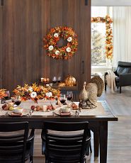 Thanksgiving table set-up with fall foliage and themed accents