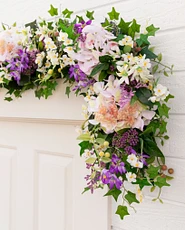 Artificial flower garland with ivy, mini grape leaves, and pothos