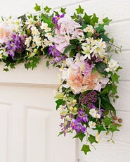 Spring flower garland over a doorway