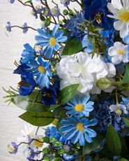 Closeup of artificial blue and white flowers