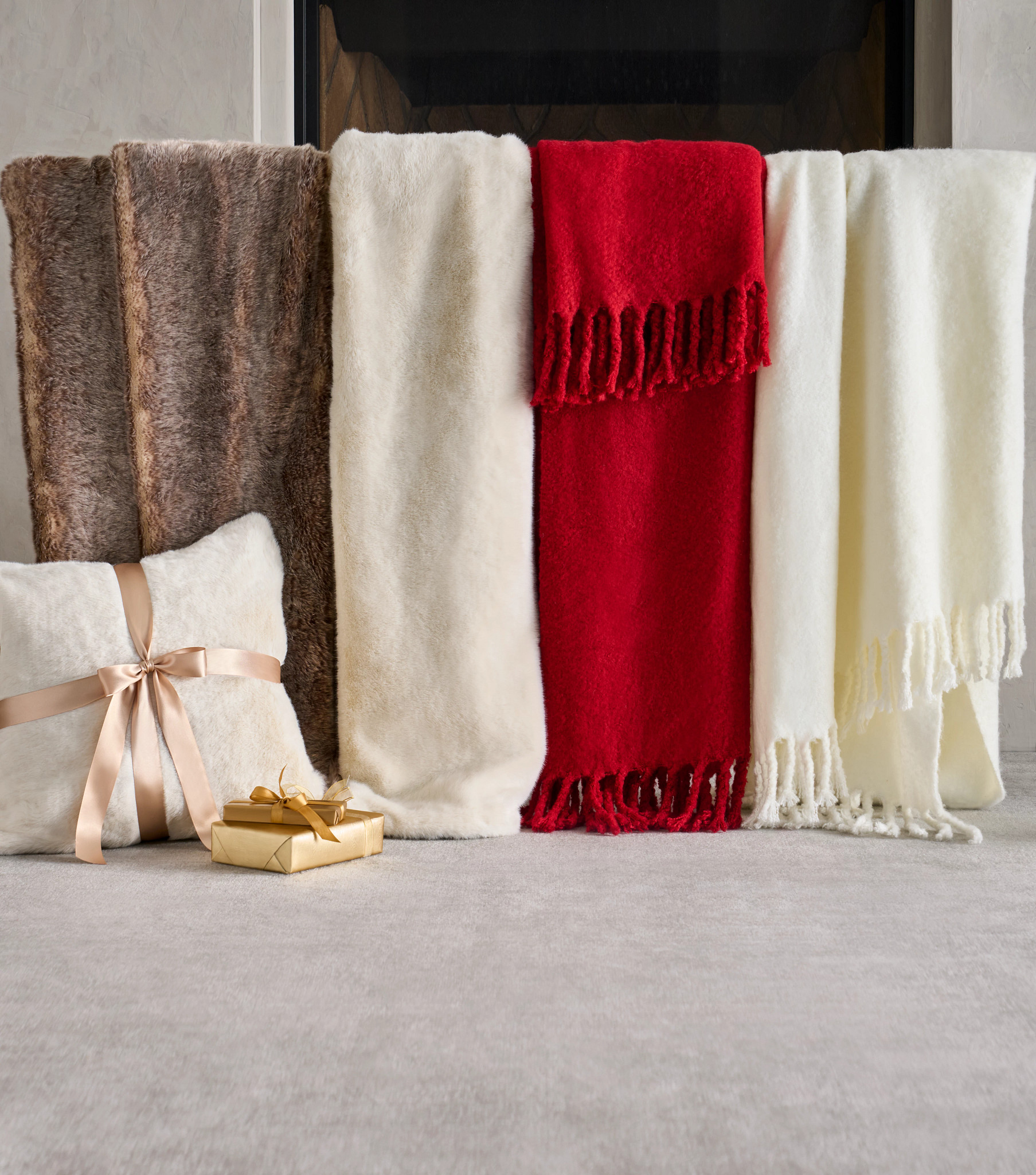 Faux fur and faux mohair throws in red, ivory, and brown colors