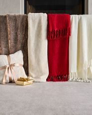 Faux fur and faux mohair throws in red, ivory, and brown colors