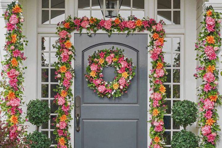 Colorful wreath and garlands on front porch