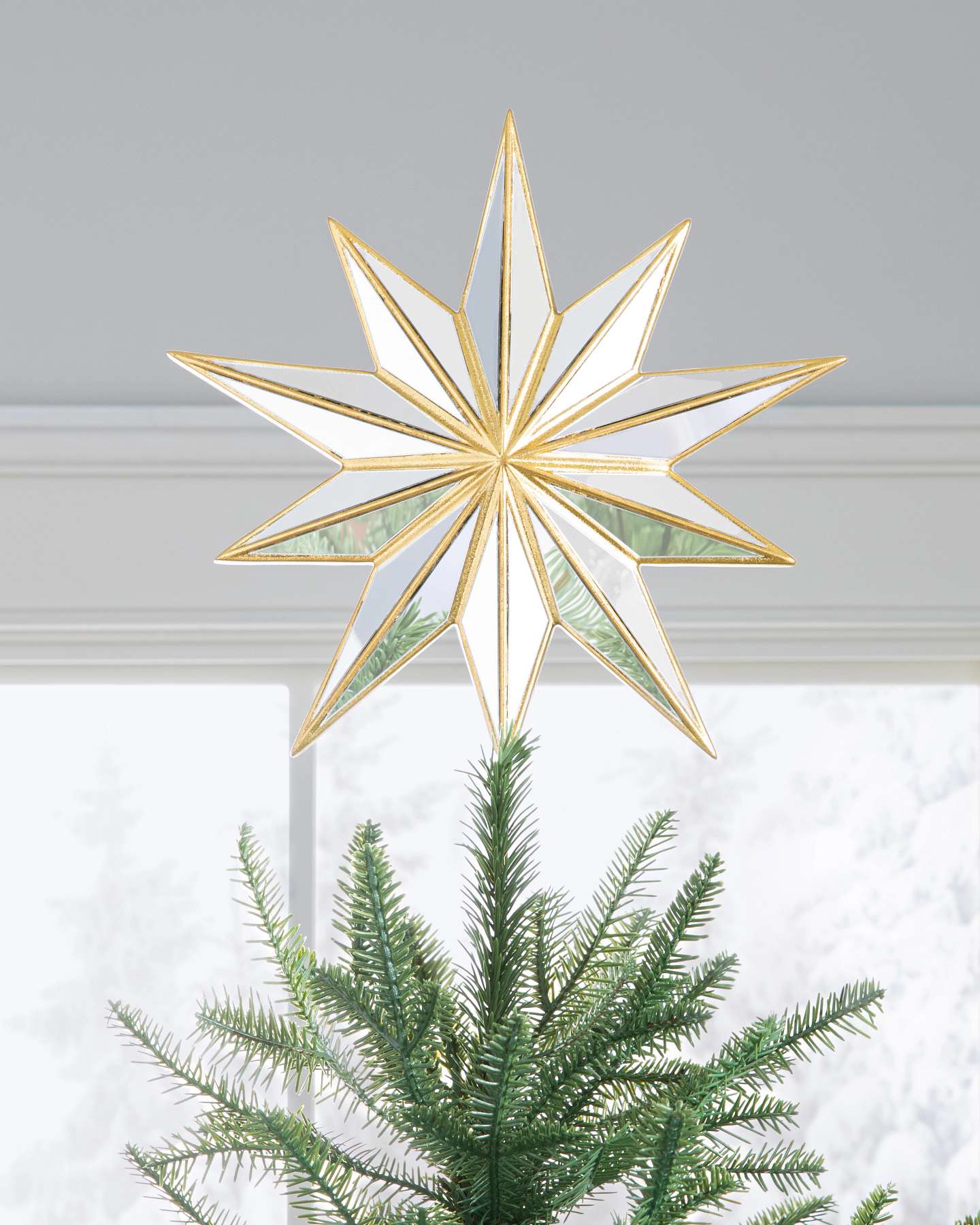 Balsam Hill Star Bright Christmas Tree Topper 11-Inch in a Festive Display
