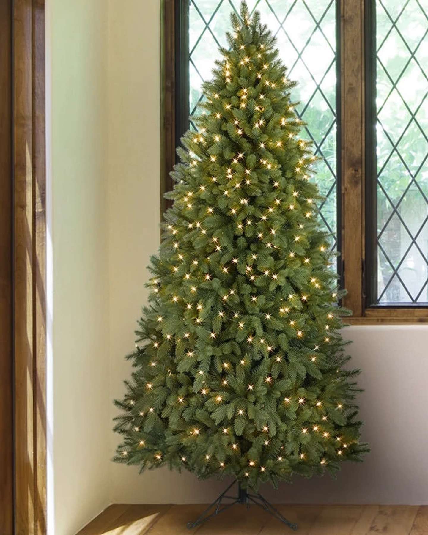 Balsam Hill Park Avenue Corner Artificial Christmas Tree in a Festive Living Room